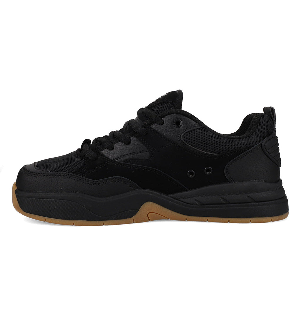 The Men’s Ascend Skate Shoes by DC Shoes are black athletic sneakers with a thick, light brown rubber sole, shown from the side against a white background. Crafted from mesh and leather-like materials, these shoes feature a lace-up closure and subtle stitching details—ideal for those who appreciate modern comfort in classic skate-inspired footwear.