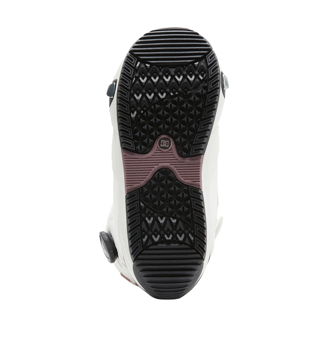 The image displays the bottom view of the DC Shoes Women’s Lotus Step On® Snowboard Boots in white, highlighting a black and brown textured rubber sole with geometric tread patterns for enhanced grip. These Step On boots are engineered to deliver optimal traction and stability on snowy terrain.