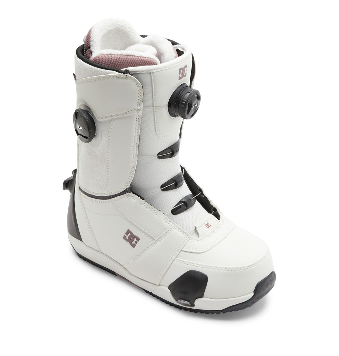 The DC Shoes Women’s Lotus Step On® Snowboard Boots showcase a white and black design with a Dual Zone BOA Fit System for precise adjustability, a black sole, padded interior, and the DC Shoes logo on the side.