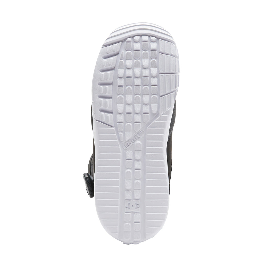 The image shows the white Unilite outsole of the Women’s Lotus BOA® Snowboard Boots by DC Shoes, viewed from below. It displays a textured tread pattern and a small circular DC logo near the heel. The sole is clean and stands out against the darker upper part of the boot.