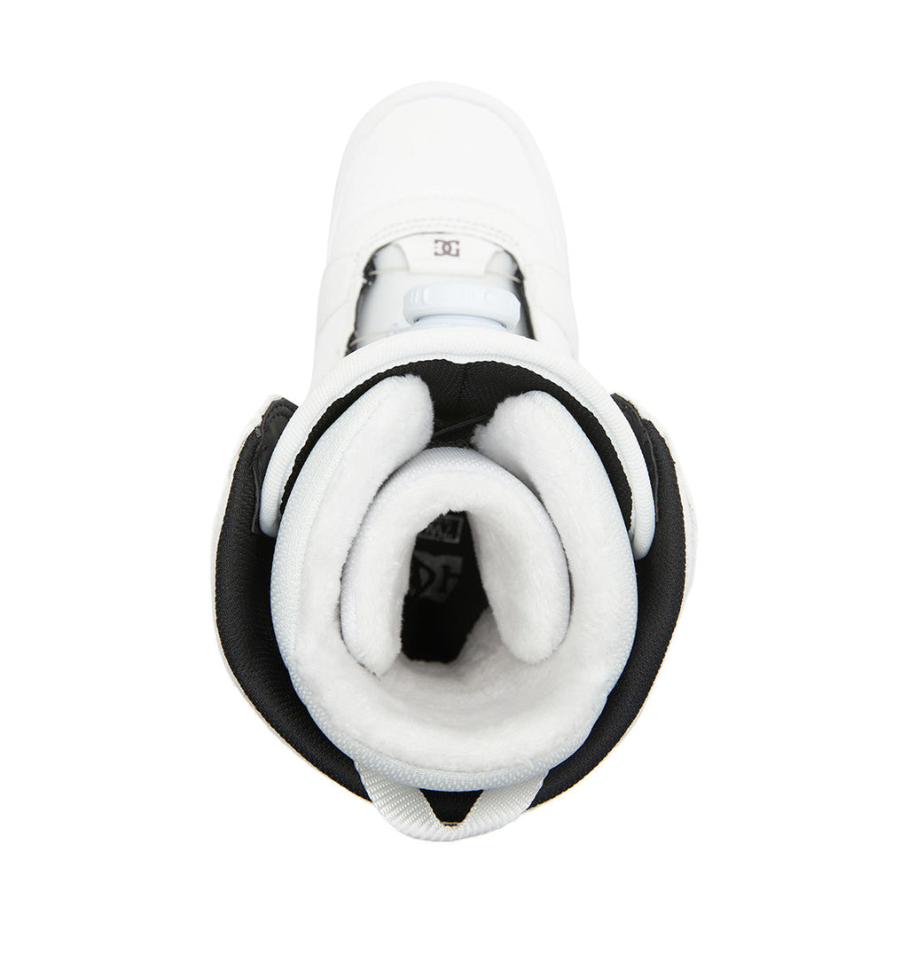 Top view of a white lined Women’s Lotus BOA® Snowboard Boot by DC Shoes, featuring black trim and revealing the plush padded interior and tongue. The DC Shoes logo is visible on the footbed inside the boot, while the advanced R2 liner ensures all-day comfort and warmth.