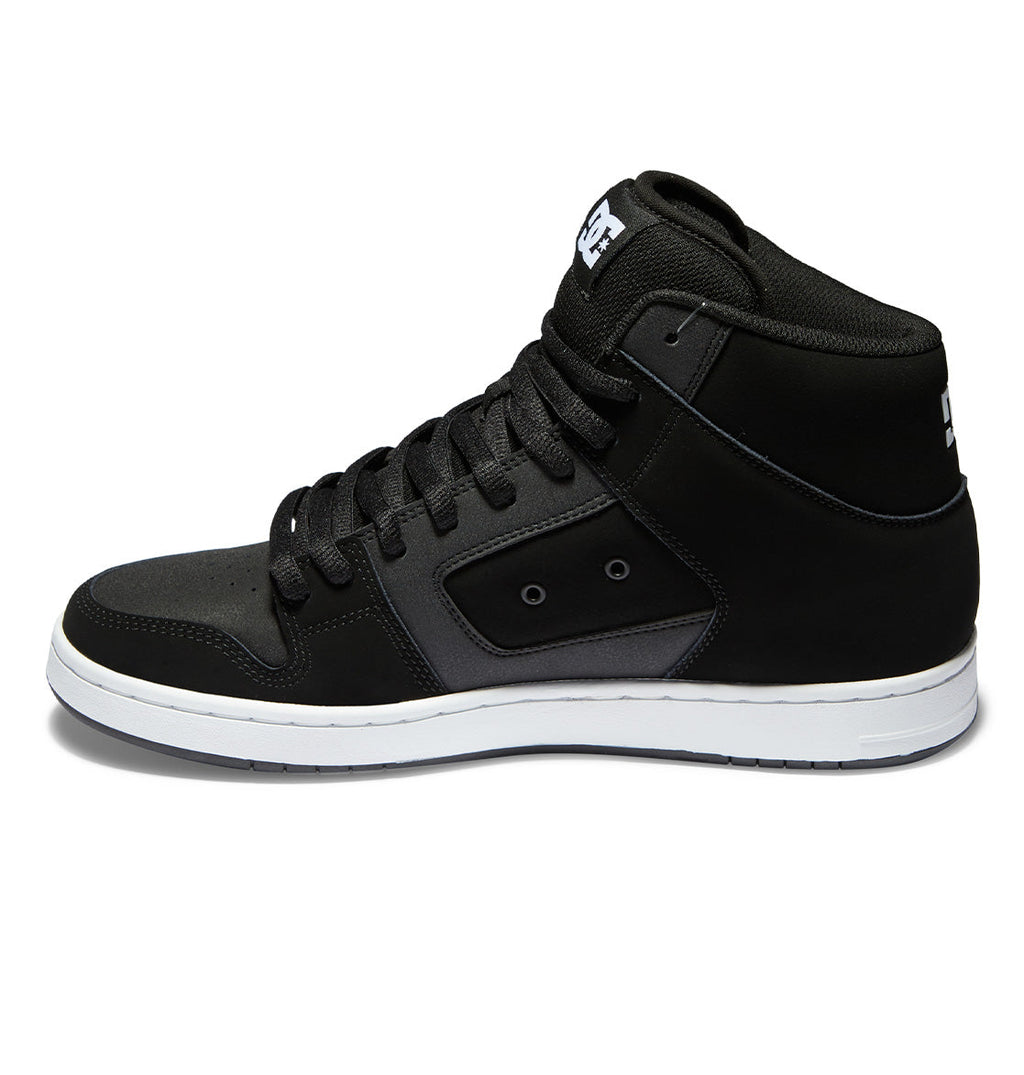 The Men’s Manteca 4 HI Shoes by DC Shoes are shown in a side profile view against a white background. Featuring a premium black leather upper with white accents, black laces, and a white rubber sole, these high-top sneakers are designed to deliver maximum grip while combining style and performance.