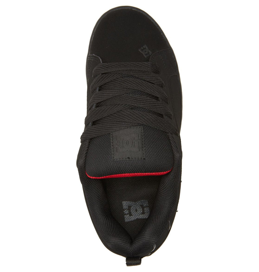 Top view of the DC Shoes Men’s Court Graffik sneaker in black, showcasing black laces, a padded tongue with the DC logo, and a touch of red lining near the heel. The signature puffy silhouette creates a bold appearance, while the interior heel features a contrasting white DC Shoes logo.