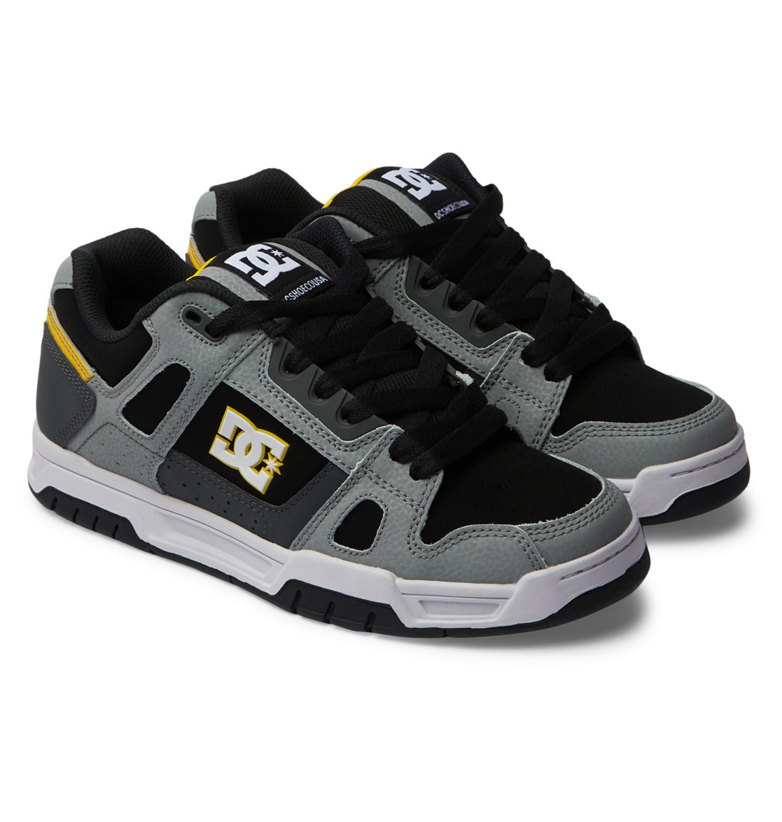 Step out in style with the Men’s Stag Shoes from DC Shoes—this pair showcases a blend of black, grey, and white with striking yellow accents. The oversized puff design is complemented by black laces, a durable cupsole, and signature DC logos on the side and tongue—all set against a crisp white background.