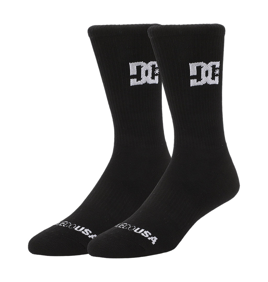 A 6-pack of black DC Shoes crew socks, each with a white DC logo on the sides and "DC SHOES USA" text at the toes, shown on a white background.