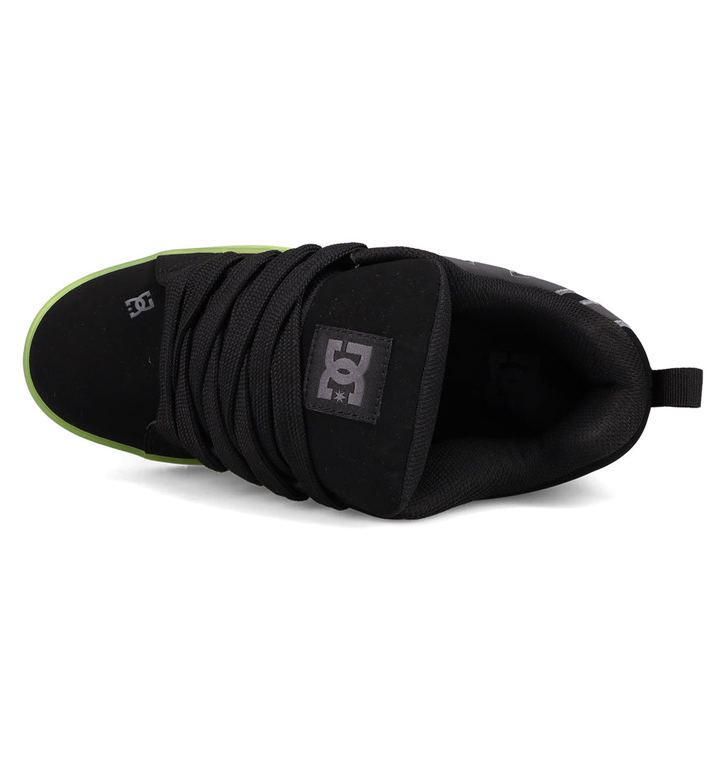 Top view of DC Shoes Men's Court Graffik SE Shoes in black with thick laces, green toe edge, and logo on the tongue, crafted with premium uppers for lasting comfort.