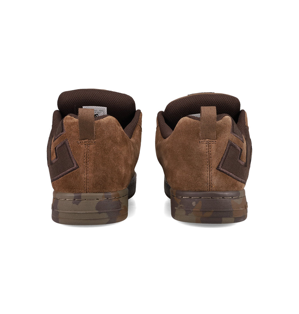 The DC Shoes Men's Court Graffik SE features a puffy silhouette, brown suede uppers, dark brown accents, geometric heel detail, and brown camo-patterned soles—all viewed from the back.