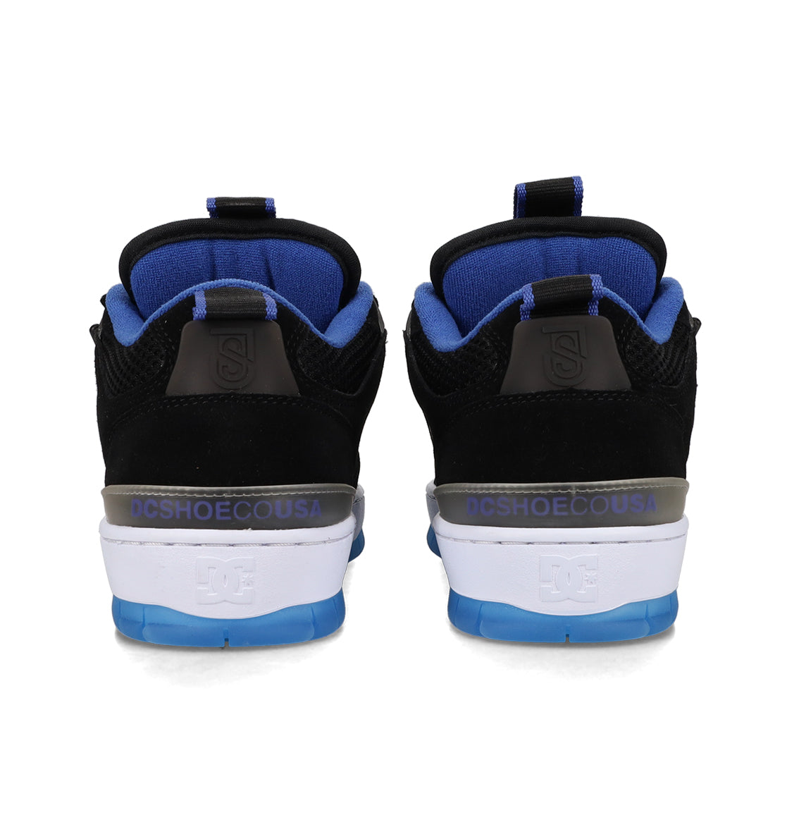 A pair of Men's JS-1 Shanahan Pro Skate Shoes by DC Shoes in black and blue, viewed from the back, displays the DCSHOECOUSA logo on the heel above a white and blue sole.