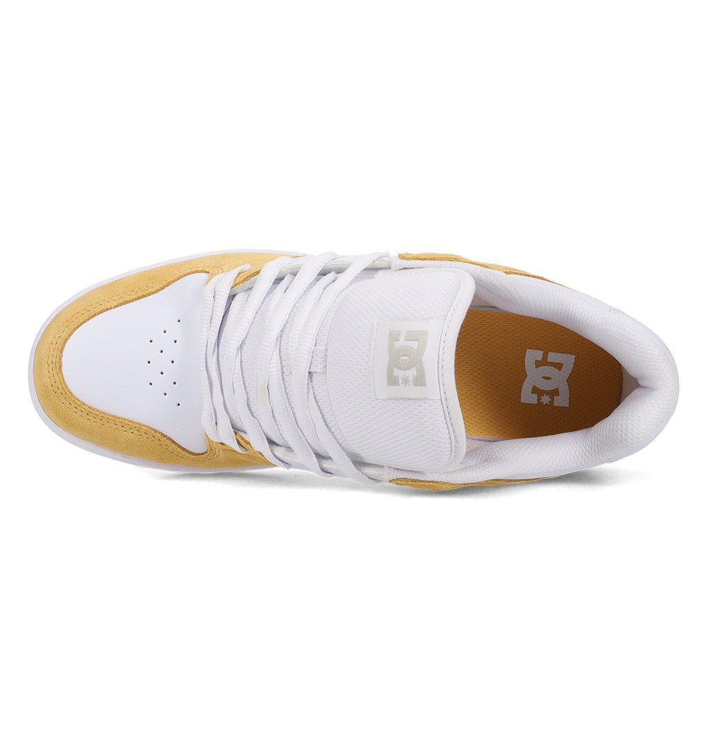 Top view of the DC Shoes Men’s Manteca 4 in white and tan, featuring white laces, a perforated toe box, and DC Shoes branding on the tongue and insole, highlighting its performance-driven design.