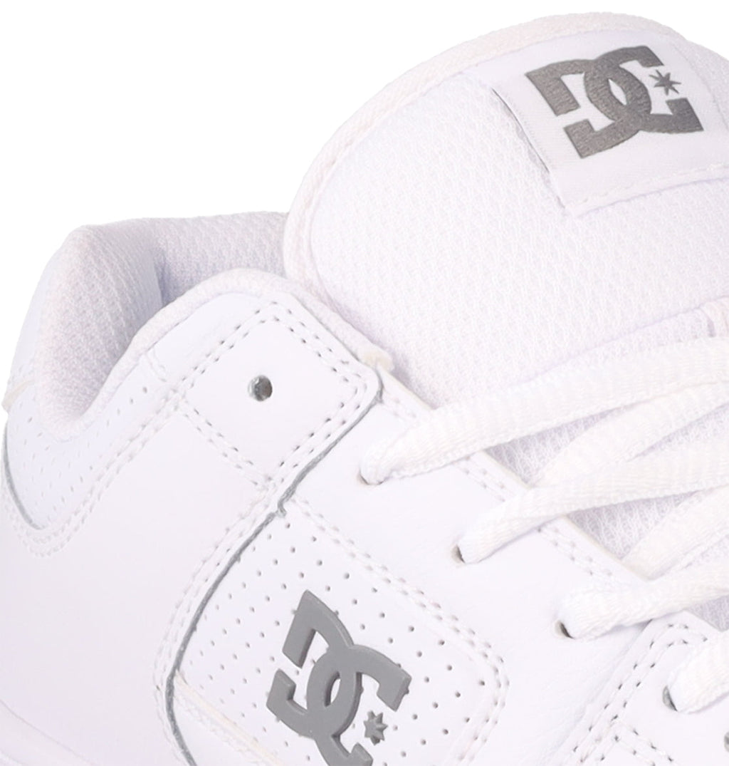 Close-up of the Women's Manteca 4 Shoes by DC Shoes, showcasing a white design with gray logos on the side and tongue, plus white laces and stitching for a performance-focused look.