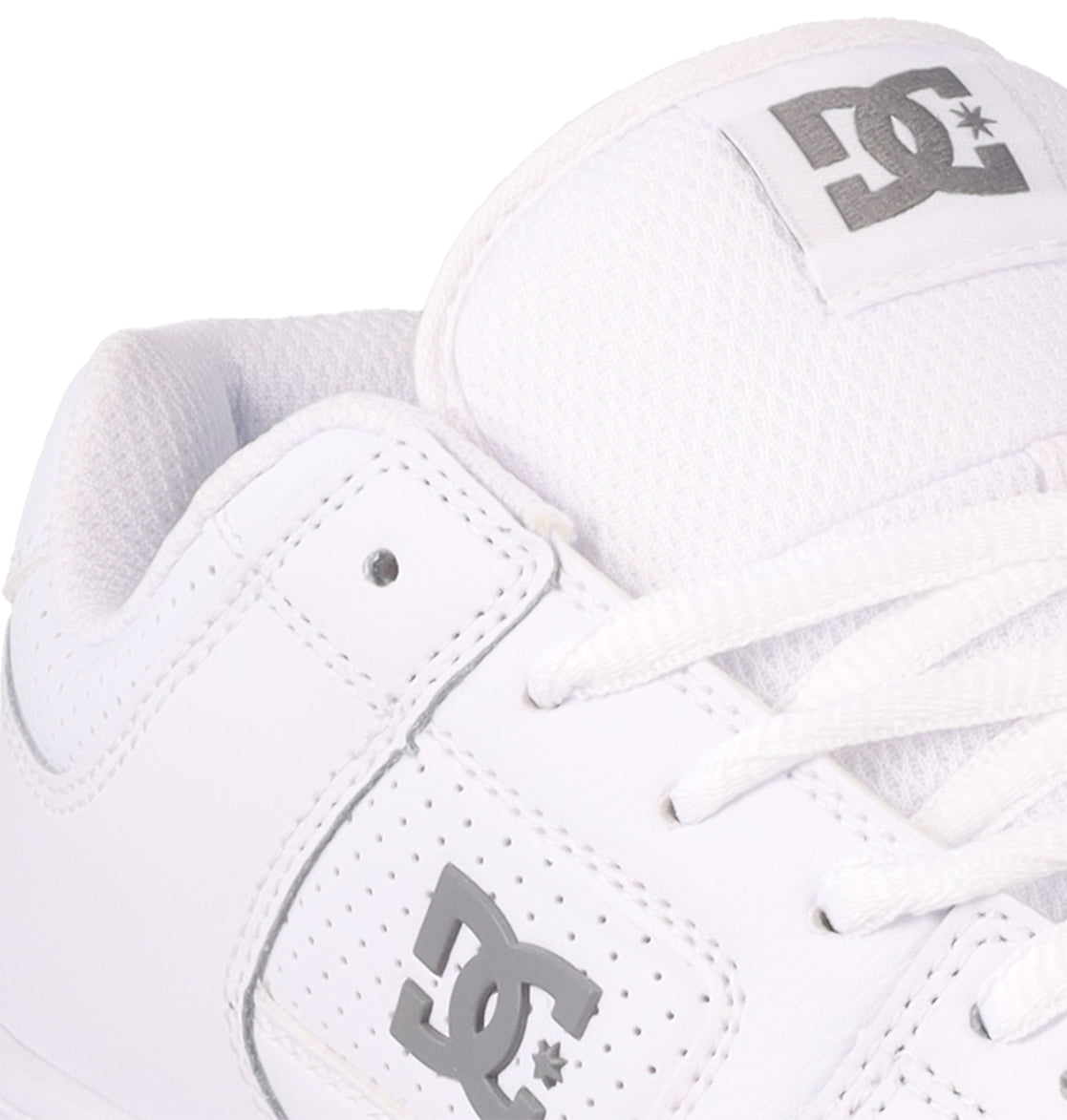 Close-up of the Women's Manteca 4 Shoes by DC Shoes, showcasing a white design with gray logos on the side and tongue, plus white laces and stitching for a performance-focused look.