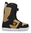 The DC Shoes Men’s Phase Boa Snowboard Boots are tan and black with a white sole, feature the DC side logo, and come equipped with a convenient Boa twist dial closure for easy adjustment. These performance snowboard boots are displayed from the side against a white background.