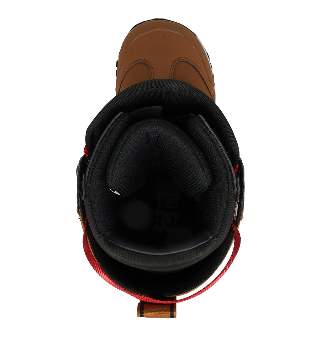 Top view of the DC Shoes Men’s Premier Hybrid Snowboard Boots in brown, featuring a black padded inner lining, red pull tab at the back, and visible ankle support cushioning—designed for performance and comfort, these hybrid snowboard boots are ideal for versatile riders seeking reliable men’s snowboard boots for their next adventure.