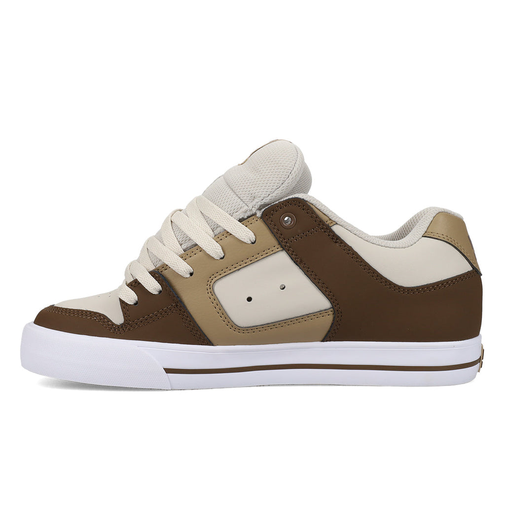 The DC Shoes Men’s Pure Shoes are low-top men’s sneakers in shades of brown, beige, and cream, featuring white laces and a white rubber sole. Shown from the side against a plain white background, these comfortable shoes offer both style and versatility.