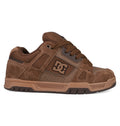 The DC Shoes Men's Stag features brown suede and leather uppers, black accents, brown laces, the DC logo on the side, and classic cupsole construction. Shown in side profile on a white background.