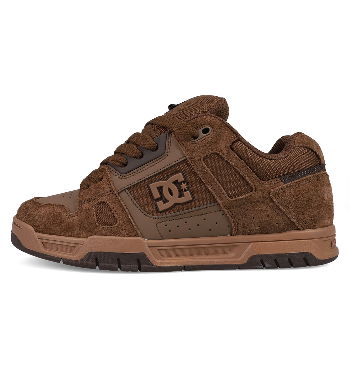 The DC Shoes Men's Stag Shoes feature a brown suede and mesh upper, thick cupsole, padded collar, and signature DC logo on the side—ideal for skate culture.