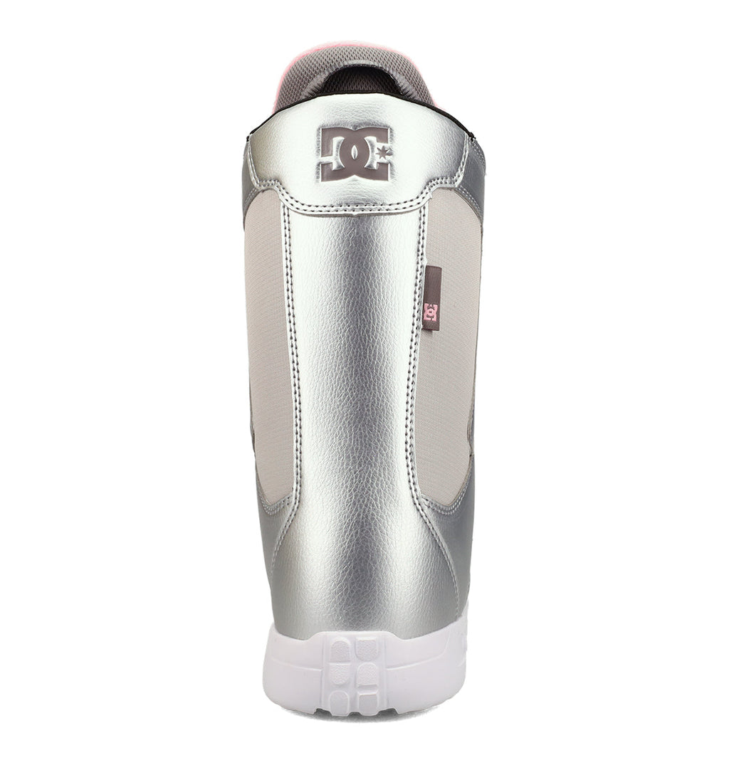 A metallic silver and white DC Shoes Women’s Phase BOA® Snowboard Boot viewed from the back, featuring the DC logo on the heel, a white sole, and supportive IMPACT-ALG insoles for enhanced comfort.