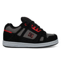 The Kids’ Stag Shoes by DC Shoes feature a black and gray design with red accents, black laces, and the signature DC Shoes logo on the side. These skate shoes offer lightweight cushioning for comfort and a gray rubber sole with a textured pattern to provide excellent grip.