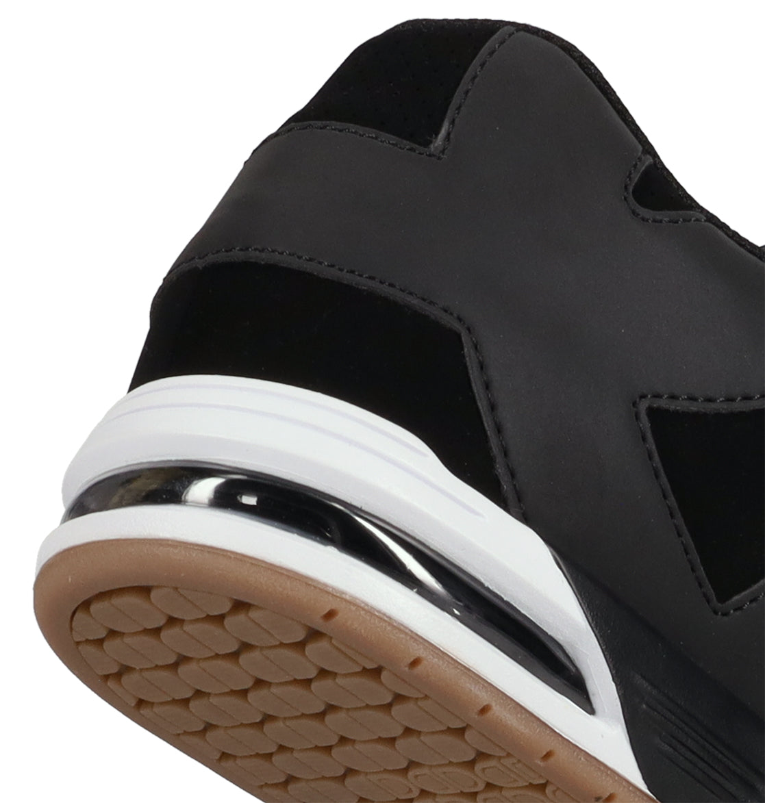 Close-up of the heel and sole of DC Shoes Men’s Command Shoes, featuring black with white and metallic silver accents, a textured rubber bottom, classic DC bulk design, and signature cushioning from the Command line.