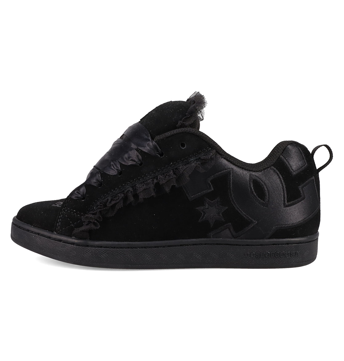 The Women's Court Graffik SD Shoes by DC Shoes feature a black suede upper, leather accents, large textured side logo, satin-style laces, low-top design, puffy silhouette, and an all-black sole for a sleek look.