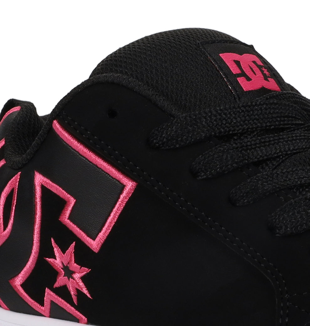 Close-up of a black Women’s Court Graffik Platform Shoe by DC Shoes, showcasing a pink embroidered DC Shoes logo with star detail, black laces, and a mesh-textured tongue—an eye-catching highlight for any women’s footwear collection.