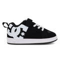 The Kids’ Court Graffik Shoes - Toddler by DC Shoes feature a puffy black upper with a large white DC logo on the side, complemented by white laces, a velcro strap, and a white sole. Inspired by the iconic Court Graffik style, these black and white sneakers are pictured in a side profile view.