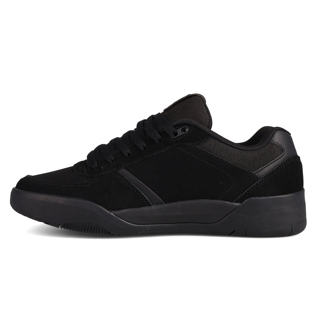 The DC Shoes Men's Fractal Shoes feature a black low-top design with suede and mesh panels, black laces, and a thick black rubber sole, offering street-ready style and comfort. Shown in side profile on a white background.