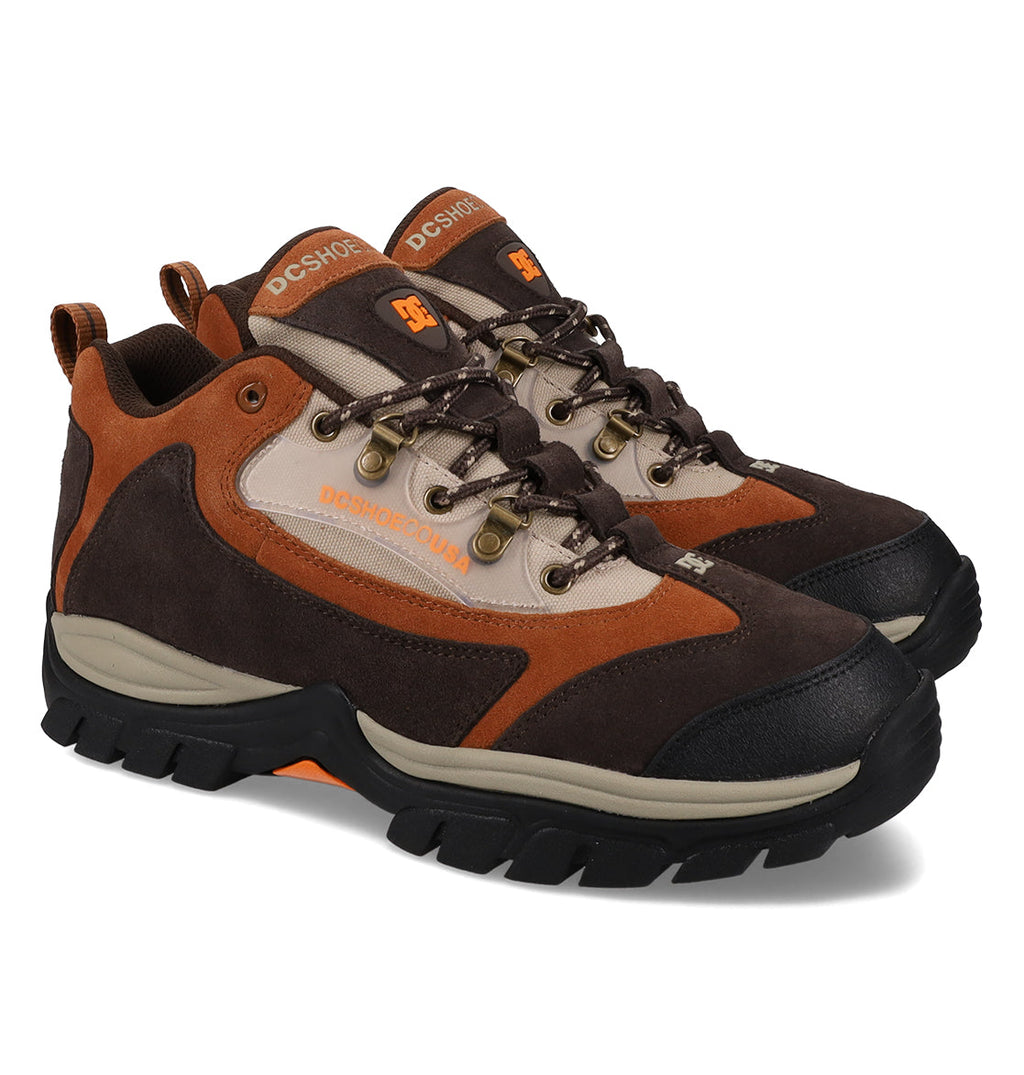 A pair of DC Shoes Men’s Recon OG Shoes in brown and tan, featuring rugged black soles and orange accents, is shown angled on a white background—these durable sneakers blend the iconic style of DC’s Recon OG line with weather-resistant features for ultimate adventure readiness.