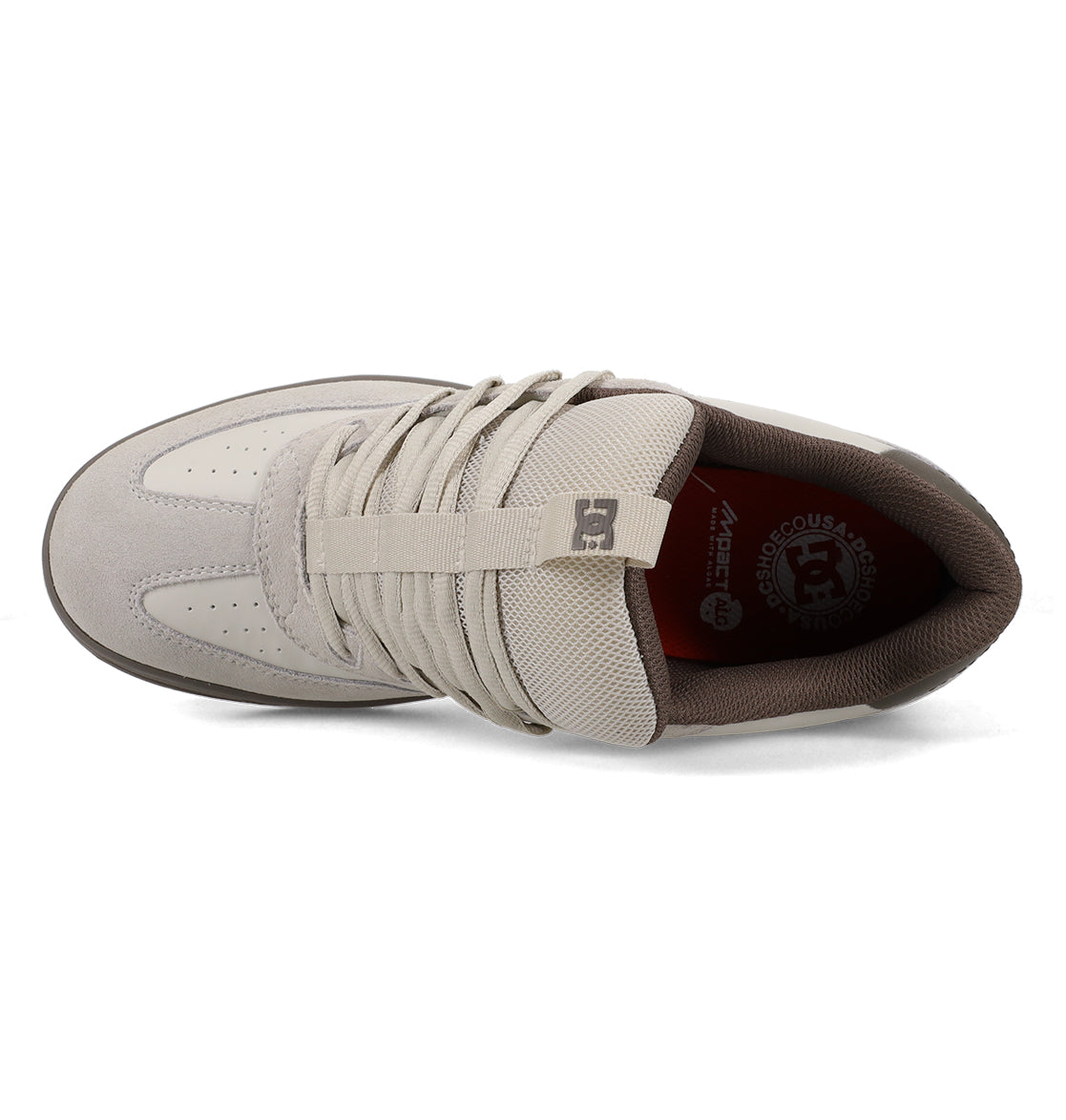 Top view of the Men’s Astrix Shoe from DC Shoes in light gray, featuring laces, a mesh tongue with the DC logo, brown inner lining, and branding on the insole—engineered for superior board control and ideal for street skateboarding.