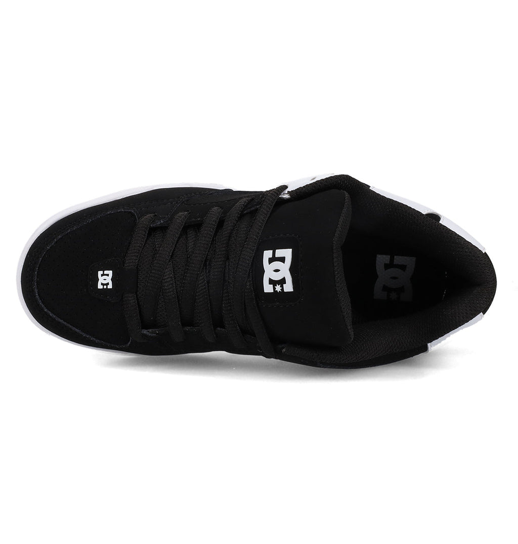 A pair of Women’s Command Shoes by DC Shoes in black, viewed from above, features black laces, a white DC logo on the tongue, and a partially visible white outsole—delivering old-school energy and signature cushioning with every step.