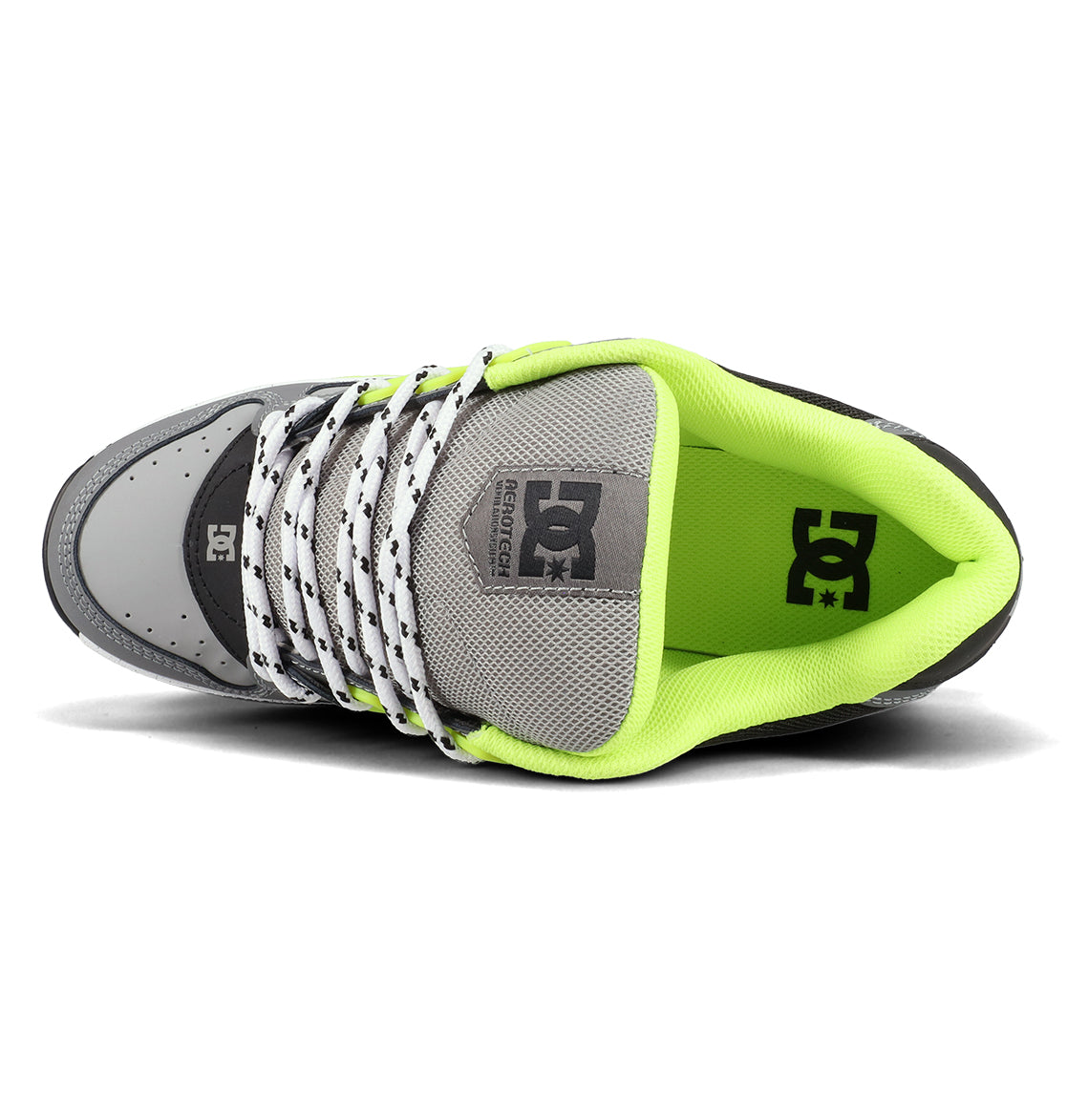 A top view of the Men’s AT-2 Shoes by DC Shoes in grey, showcasing white laces with black dots, a mesh tongue, and a neon green inner lining. The DC Shoes logo appears on both the insole and tongue, while the AEROTECH ventilation system provides breathability and superior cushioning for all-day comfort.