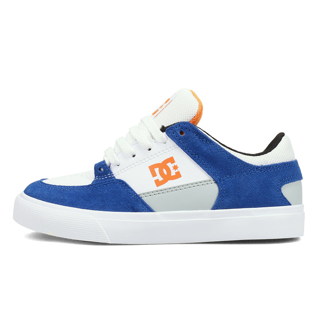 The DC Shoes Kids’ Onyx Shoes feature a minimal vulc silhouette in blue, white, and gray with an orange logo on the side, white laces, and a white textured rubber toe cap—making them an everyday go-to for casual style and comfort.