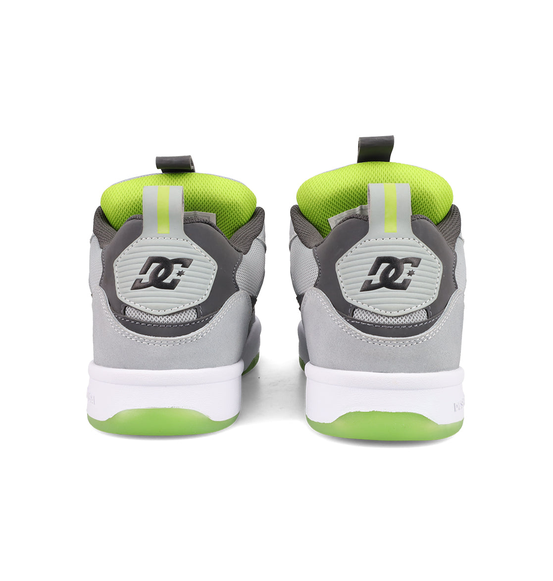 A pair of gray and white Men's JS 2 Shoes from DC Shoes seen from the back, with green inner lining, green and white soles, and the DC logo on the heel—reflecting DC Shoes heritage in every detail.