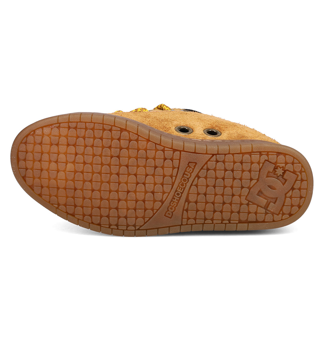 Bottom view of the DC Shoes Men's Court Graffik Puff Shoes in brown, showing a textured rubber sole with the logo and DCSHOECOUSA text. The tan upper has eyelets and a puffy silhouette for classic DC style.