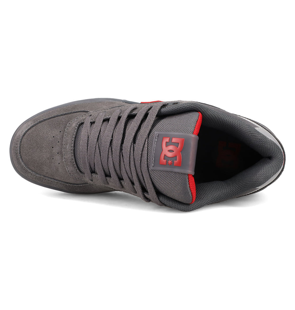 Top view of DC Shoes Men's Fractal SE shoes in gray with a red tongue accent and logo. These sneakers feature gray laces, suede-like texture, padded collar, and deliver everyday comfort and street-ready style.