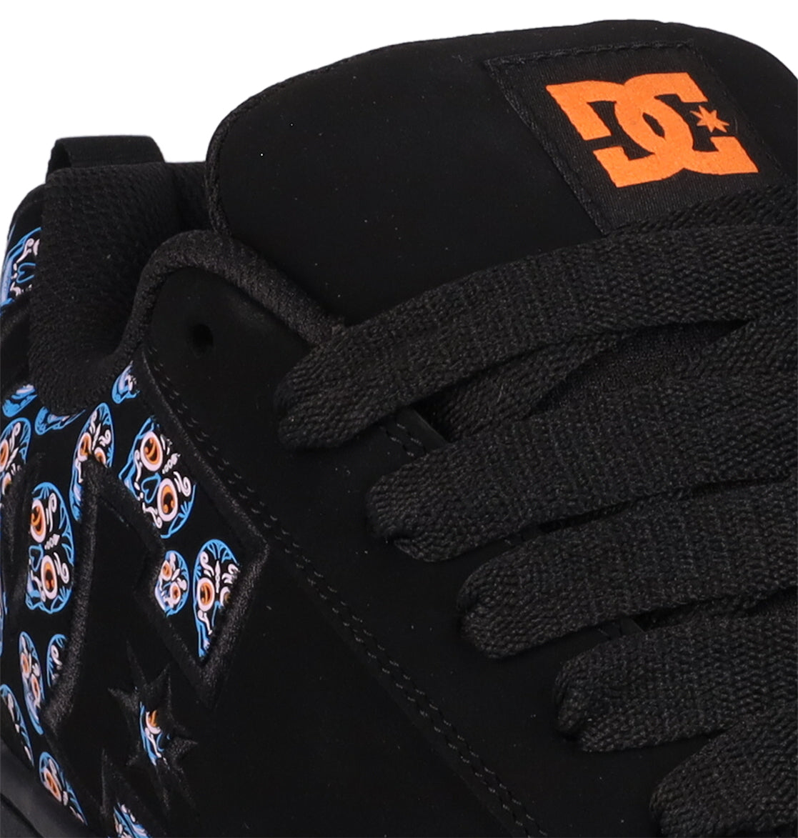 Close-up of the Men’s Court Graffik Day Of The Dead skate shoe by DC Shoes, featuring thick black laces, an orange DC Shoes logo on the tongue, and a blue and orange patterned side panel inspired by Día de los Muertos.