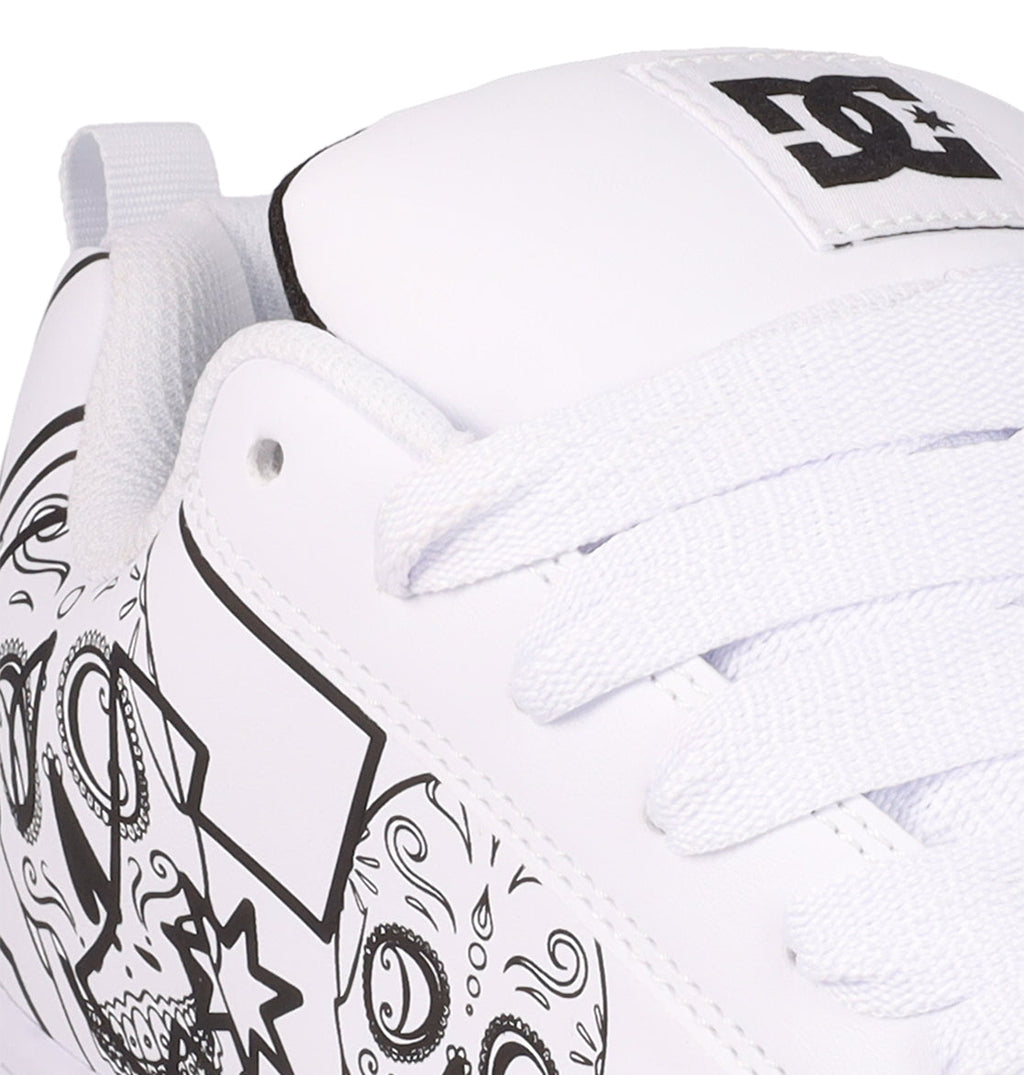 Close-up of the DC Shoes Men’s Court Graffik Day Of The Dead sneaker, showcasing black outlined doodle designs, white laces, and a DC Shoes logo on the tongue—a creative homage to Día de los Muertos.