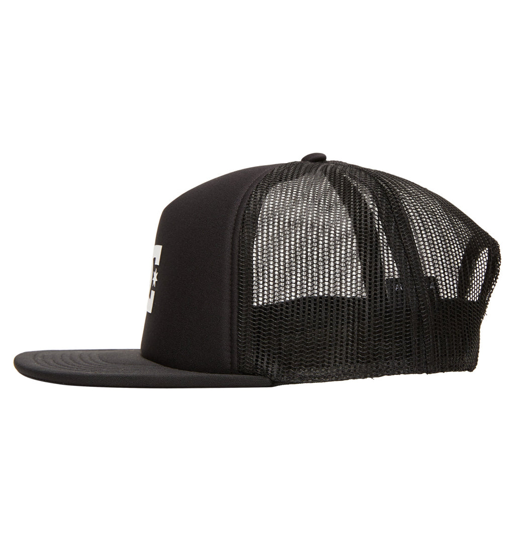 The Reebok Gas Station Trucker Boy is a black trucker cap with a flat brim and mesh back panels, shown from the side on a white background.