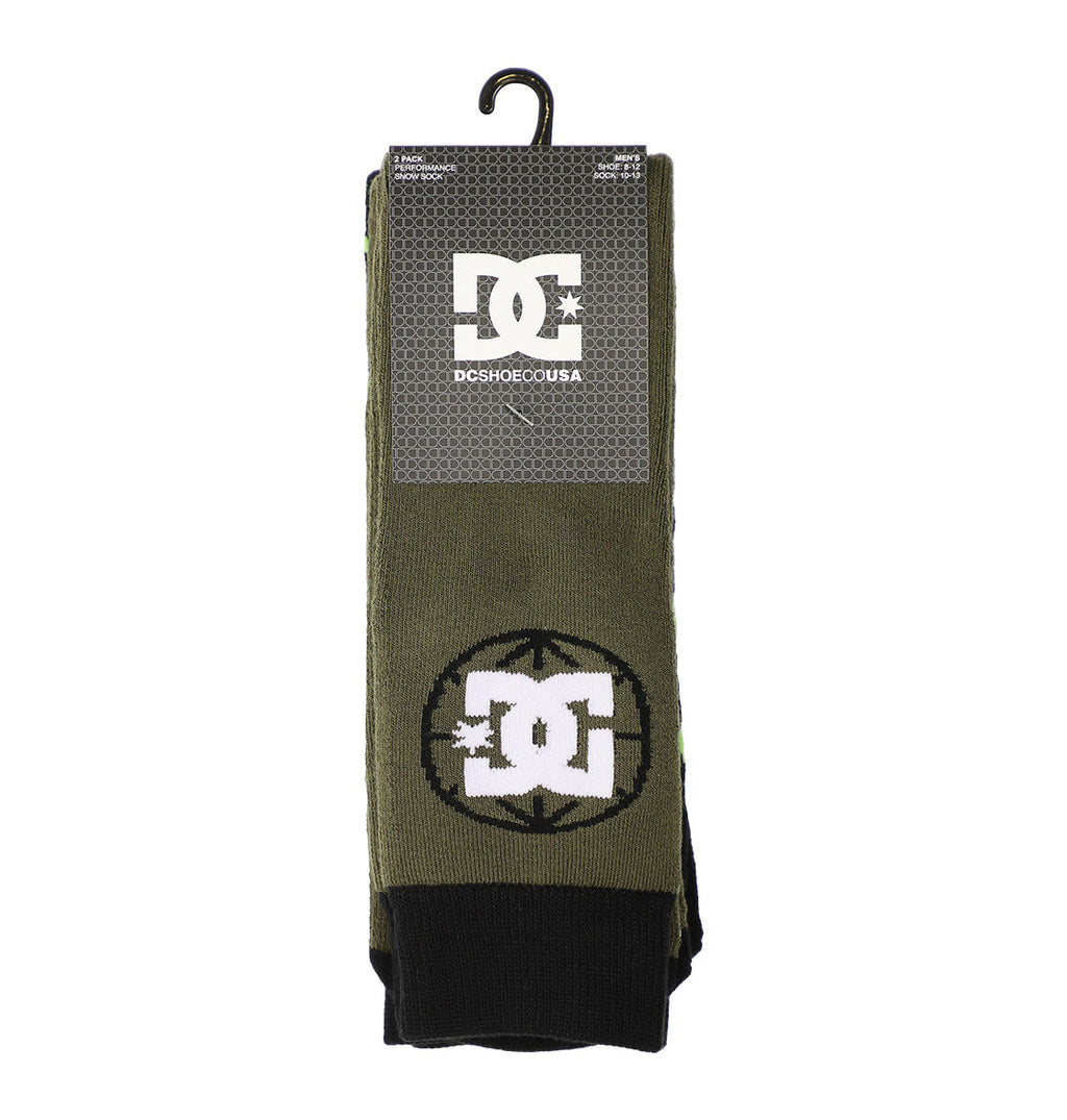 The Performance Socks 2-Pack by DC Shoes features olive green socks with black toes, displayed in branded packaging with the DC Shoes logo in black and white, hanging from a black hook.