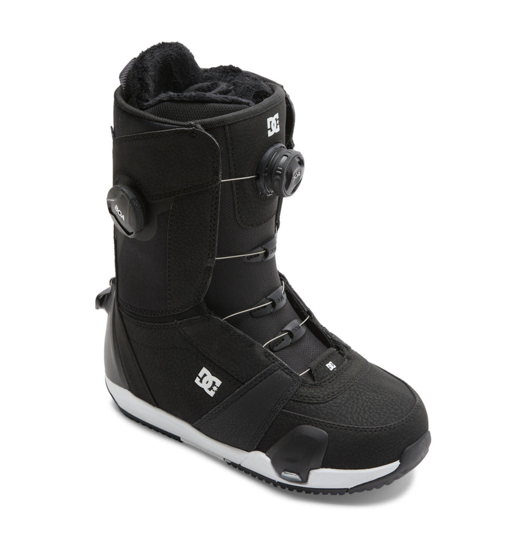 A black Women’s Lotus Step On® Snowboard Boot by DC Shoes, featuring the Dual Zone BOA Fit System, DC Shoes logos on the side and front, and a textured sole for grip.