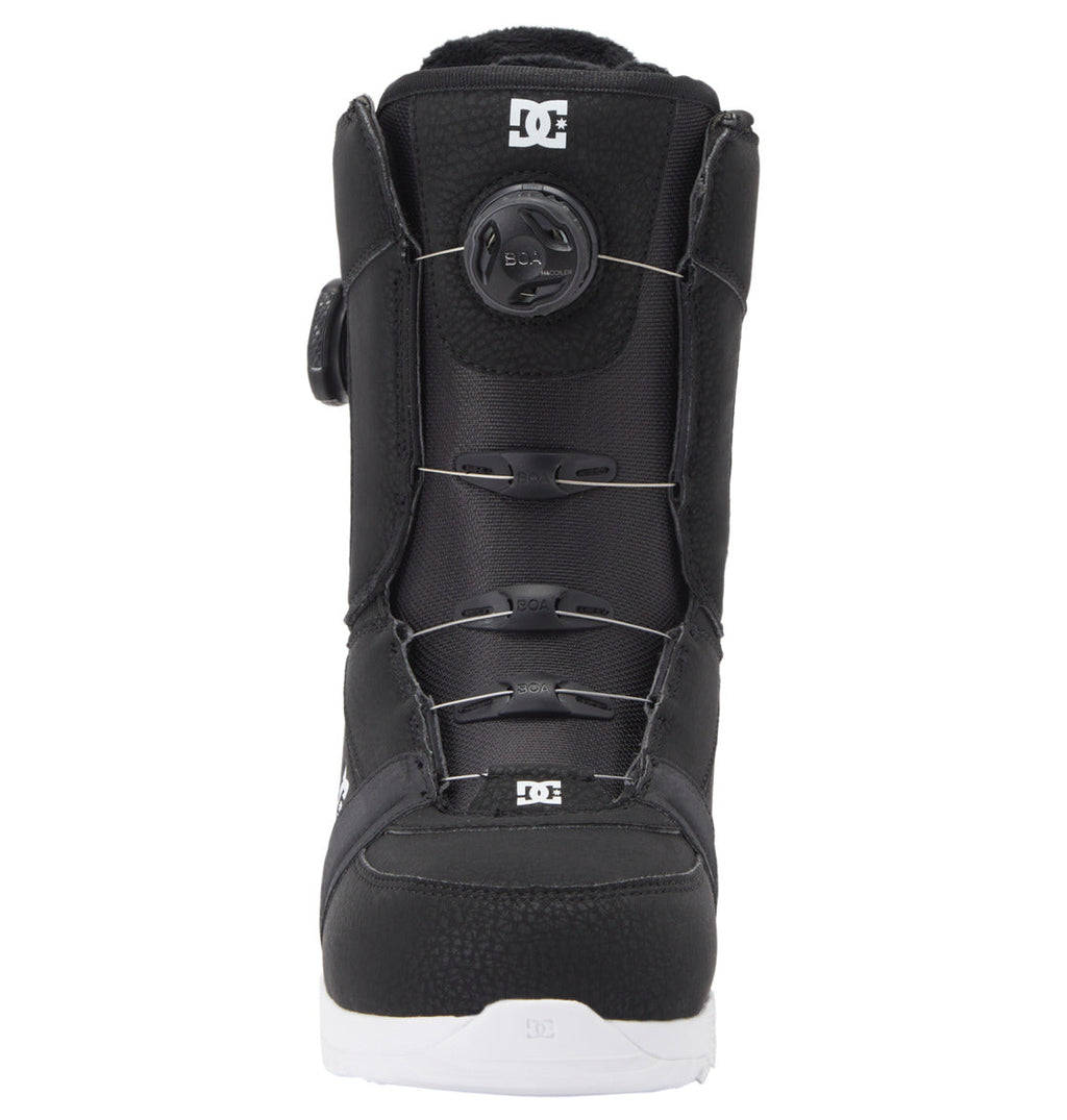 The Women's Lotus BOA® Snowboard Boots by DC Shoes are black with a white UNILITE outsole, feature a Dual Zone BOA Fit System, and display the DC Shoes logo on the tongue and toe. Shown from the front against a white background.