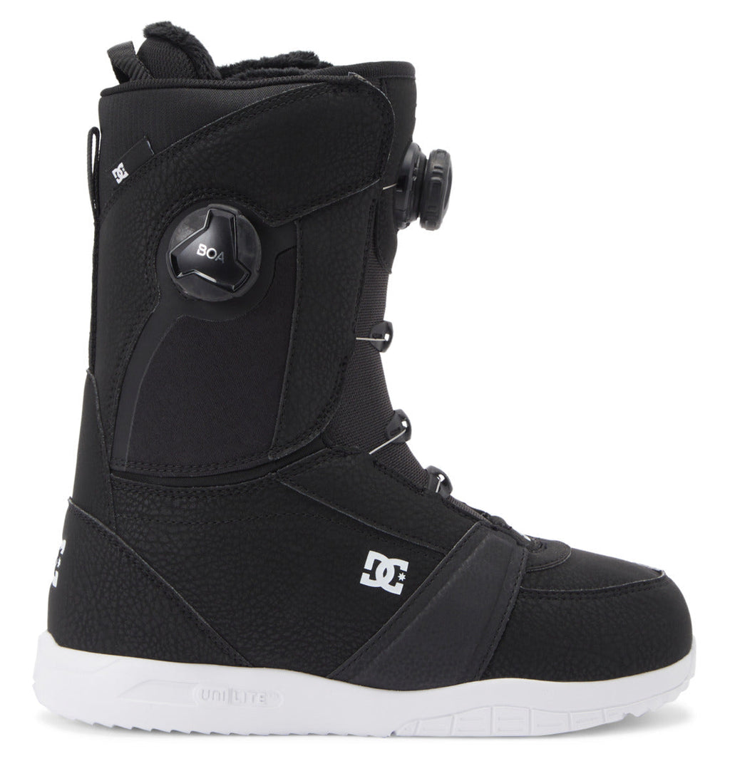 The DC Shoes Women's Lotus BOA® Snowboard Boots are black with a white UNILITE outsole, side BOA dial lacing system, and DC logo on the side, shown in profile facing right against a white background.