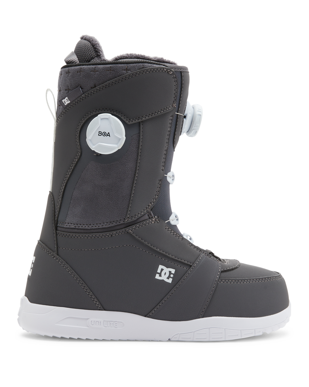 The DC Shoes Lotus snowboard boot features a dark gray design with a white sole, white laces, and a round white BOA dial on the side. The DC Shoes logo appears near the heel and ankle.