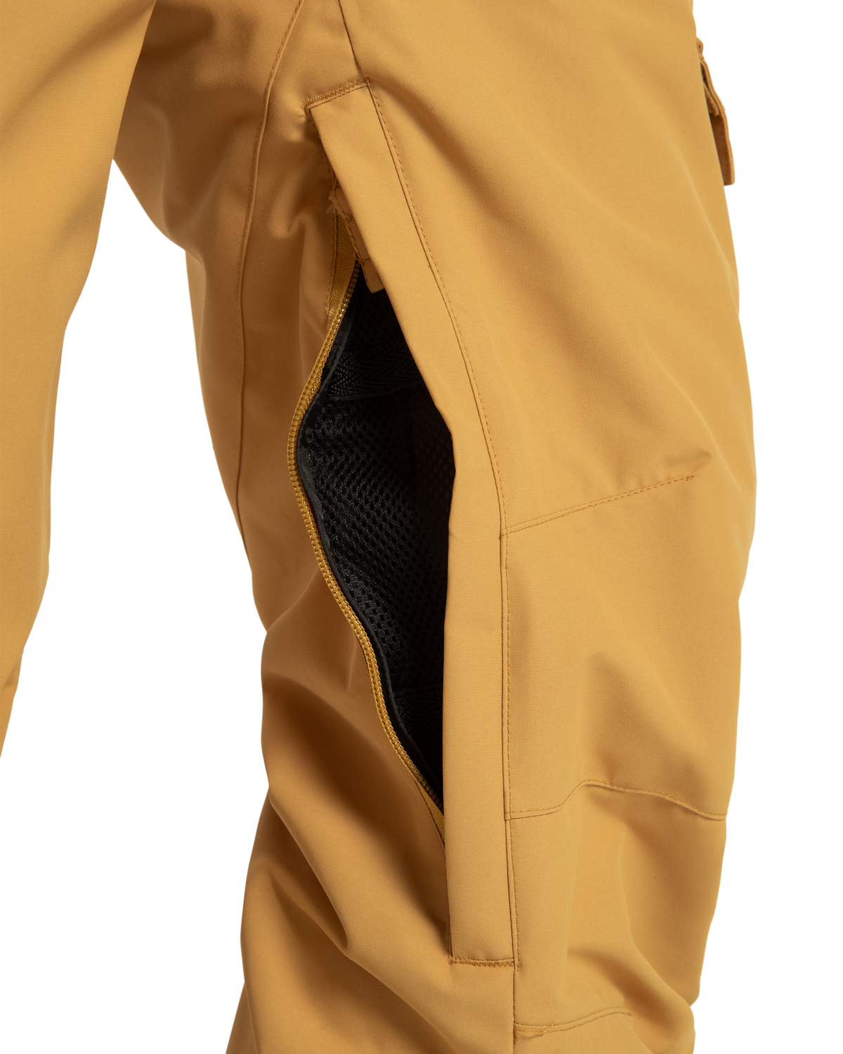 Close-up of DC Shoes Women’s Nonchalant Insulated Snow Pants in mustard yellow, featuring a partially open side zipper that reveals black mesh lining. Made from recycled polyester for sustainability.