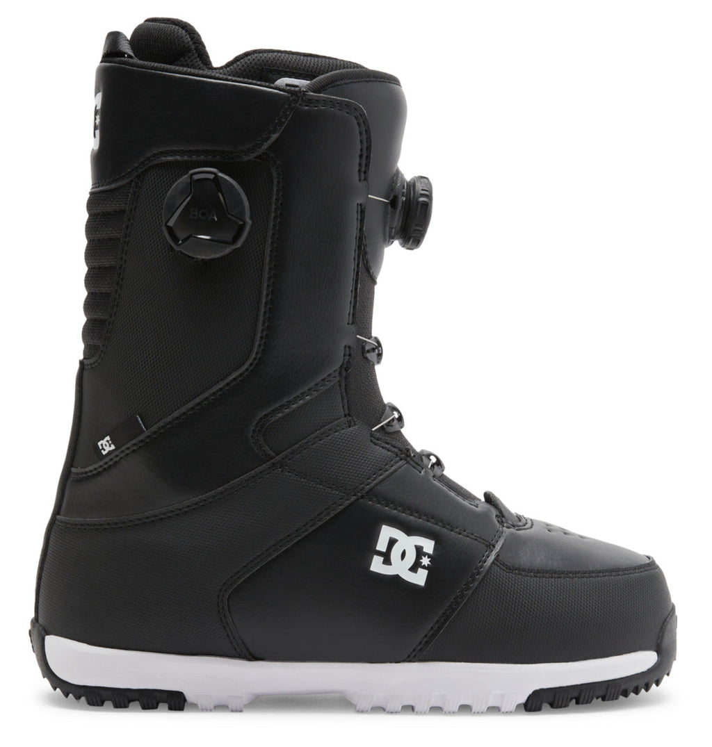 The Men’s Control BOA® Snowboard Boots by DC Shoes are shown in profile against a white background, featuring a black upper with a white sole, side BOA dial, reinforced stitching, and the DC logo on the side. These all-mountain boots utilize the Dual Zone BOA Fit System for precise adjustment and blend advanced snowboarding performance with signature DC skate style.