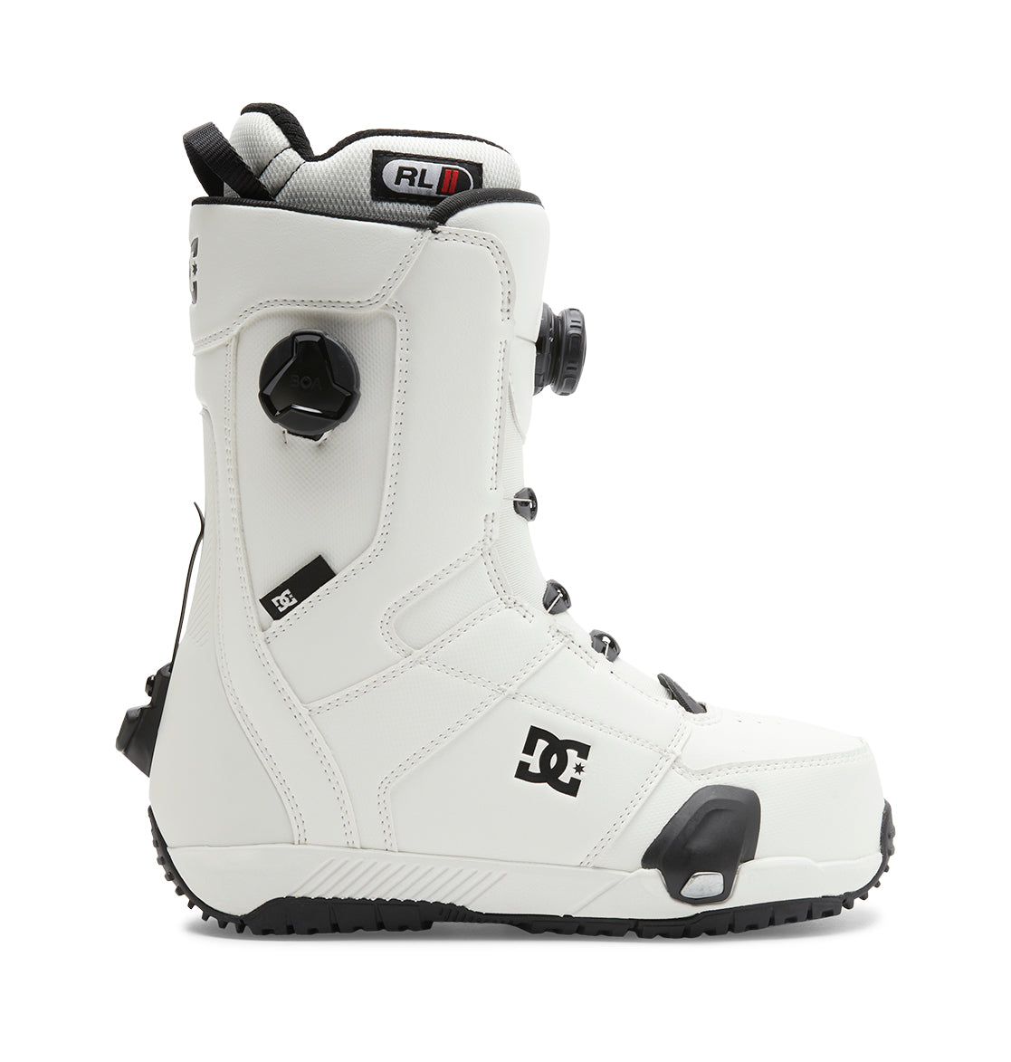 Introducing the Men’s Control Step On® Snowboard Boots by DC Shoes: These white boots feature black accents, a textured sole, and a side dial tightening system. Showcasing advanced snow boot technology, they come equipped with the Dual Zone BOA Fit System for customizable comfort and security. The signature DC Shoes logo appears near the ankle.