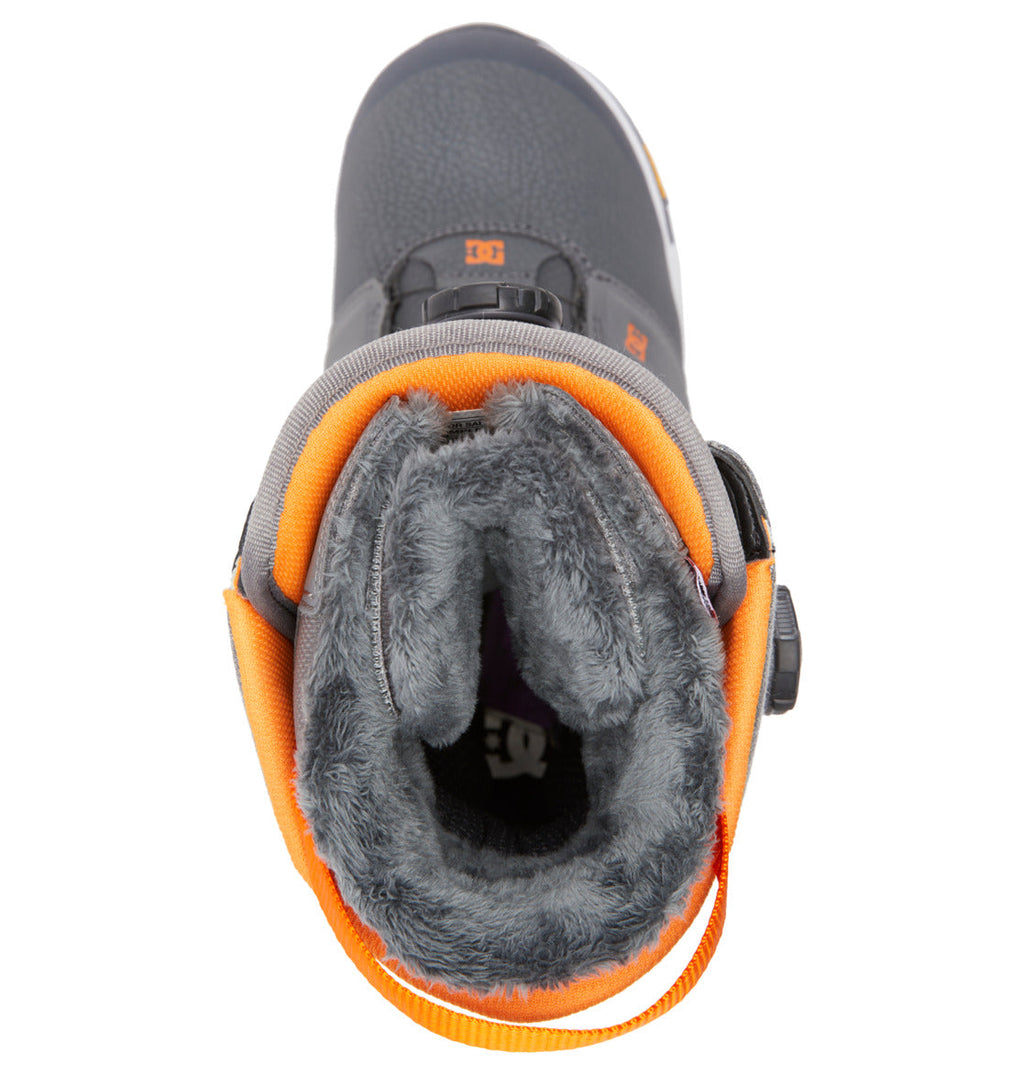 Top view of a single dark gray DC Shoes Men’s Judge BOA® Snowboard Boot featuring a fuzzy gray lining, orange accents, a pull tab at the back, and a durable Vibram outsole for enhanced traction.