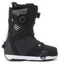 A pair of DC Shoes Men’s Judge Step On® BOA® Snowboard Boots in black, featuring a white sole, textured paneling, and adjustable BOA® Fit System dials on both the side and tongue for a secure fit. The boot is positioned upright, showcasing its side profile and distinct sole details.