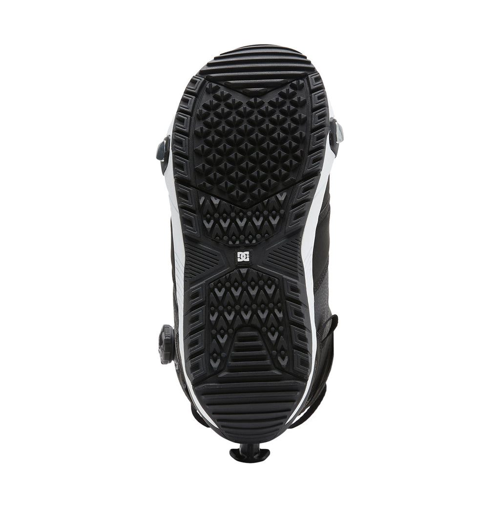 Men’s Judge Step On® Snowboard Boot by DC Shoes viewed from the bottom, featuring a detailed geometric tread pattern with a small DC logo at the center and two white side panels along the sole for added grip and structure—engineered for seamless integration with Judge Step On bindings.