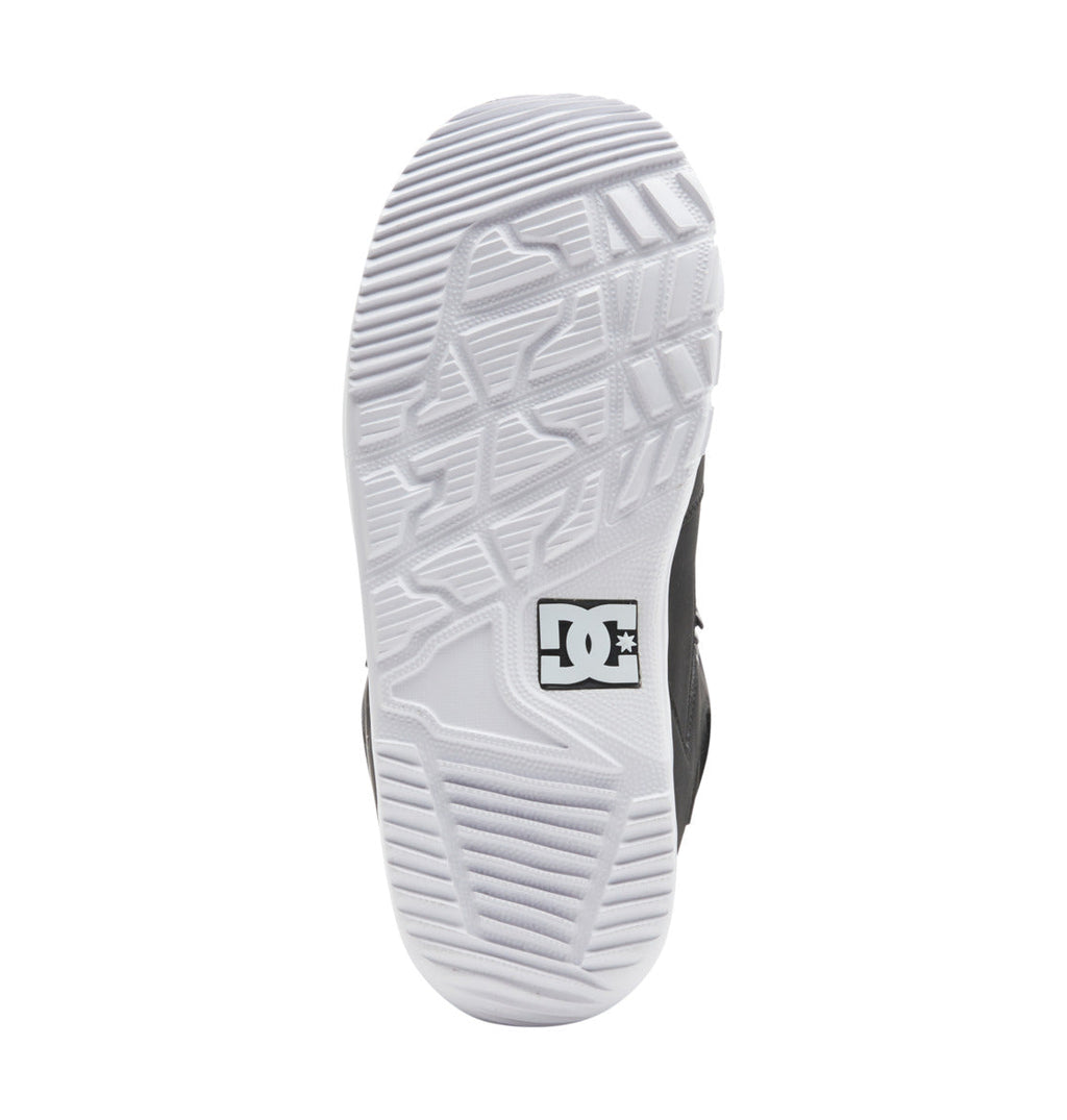 The image displays the bottom view of the DC Shoes Men’s Phase Lace Snowboard Boots, featuring a white sole with textured patterns and a DC Shoes logo near the heel. Designed for medium flex performance, this model includes traditional lace closure to ensure a secure fit.